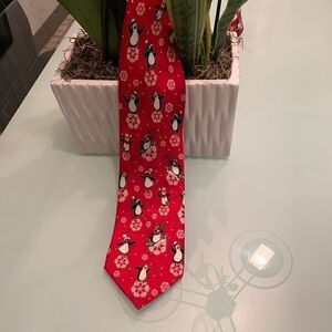 Holiday tie red with penguins and snow flakes